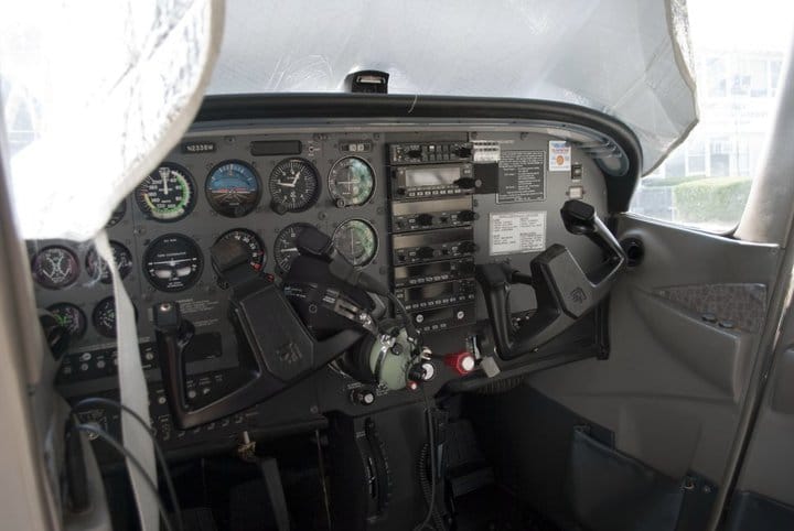 Controls inside the cockpit of a small plane.