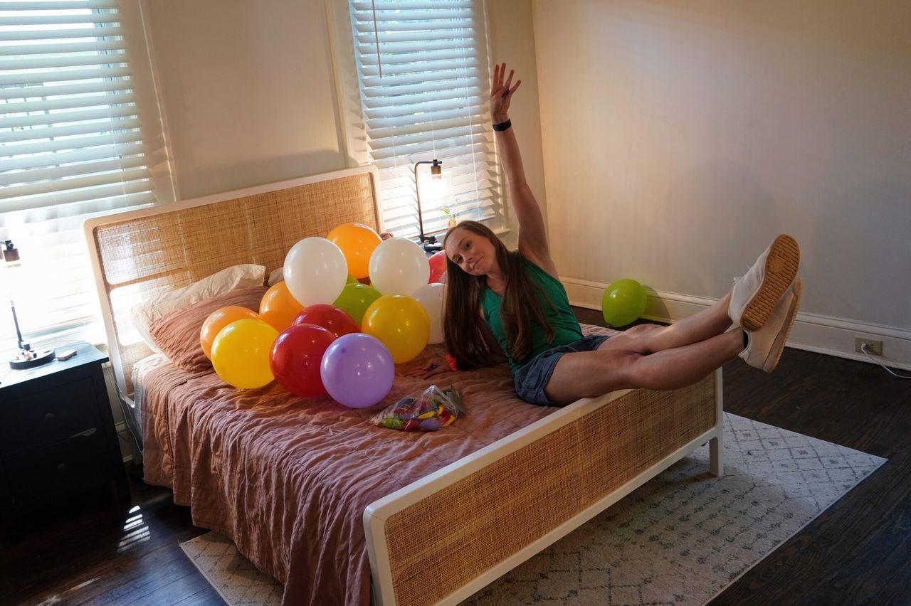 Bed full of baloons.