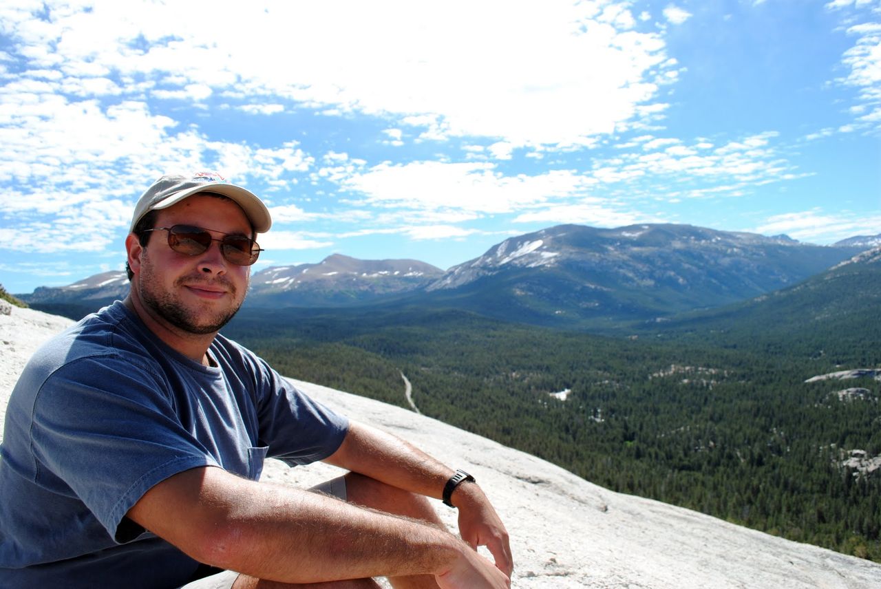 Photo of me with a hat and glasses on top of Lembert Dome.