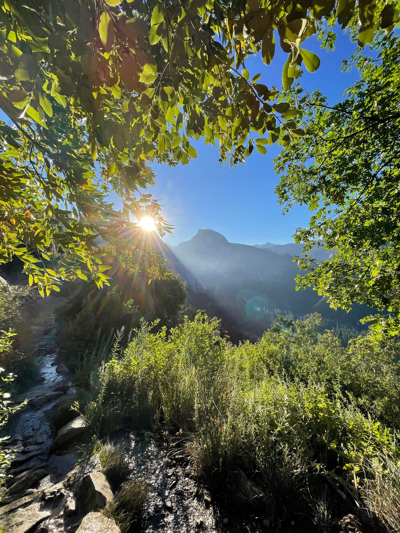 The sun peaks over the valley walls.