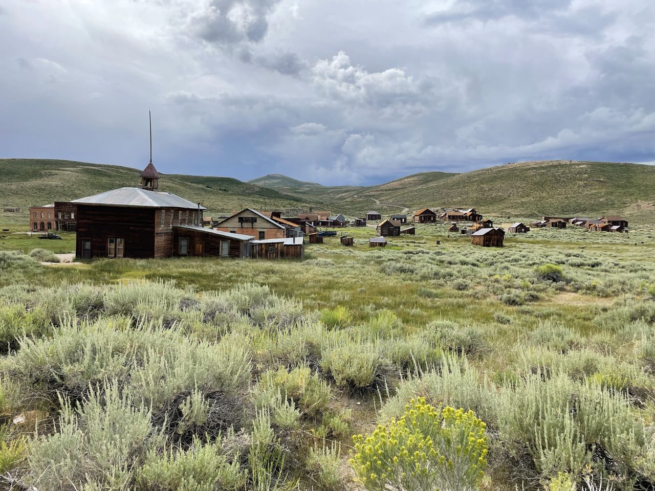 The schoolhouse with the rest of Bodie behind it.