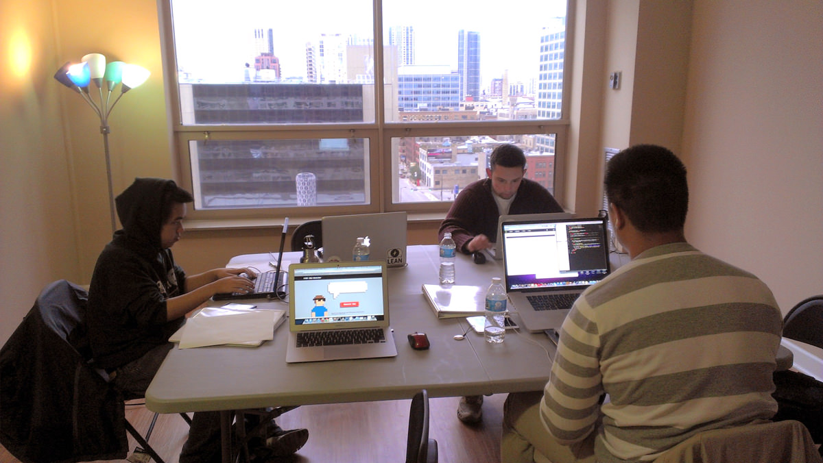 Friends work around our two fold out tables in the living rrom.
